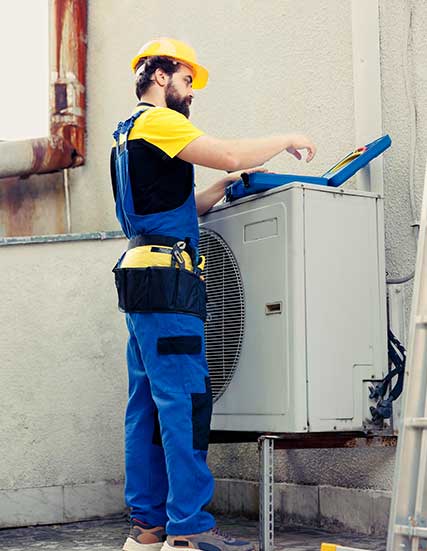 A professional installing makeup air unit